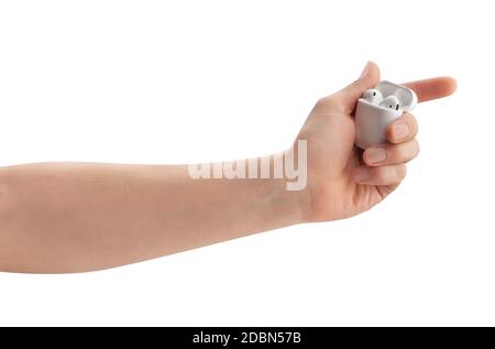 air pods charging case in hand path isolated on white Stock Photo