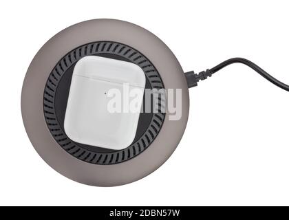 wireless charger with air pods charging case on path isolated on white Stock Photo