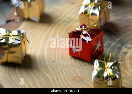 small gift boxes in rustic wood. gift boxes. Stock Photo