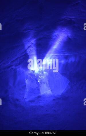 Expoloding Ice Chunks A small light source causes exploding purple rays to spread out from ...