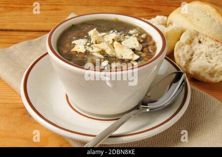 A cup of lentil soup on a rustic wooden table Stock Photo