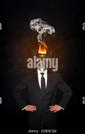 Overworked burnout business man standing headless with broken Bulb instead of his head. Symbolic Image - Stress Concept Stock Photo
