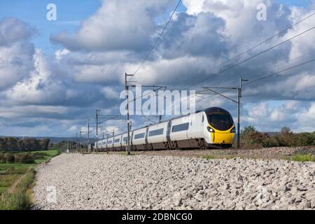 Avanti west coast class 390 Alstom  Pendolino train on the west coast mainline in Lancashire Stock Photo