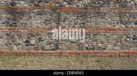 old red bricks and stones wall useful as a background Stock Photo
