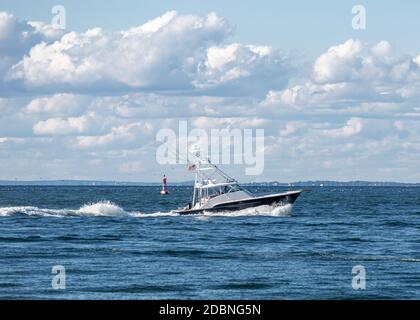 Boat off Gin Beach, Block Island Sound, Montauk, NY Stock Photo