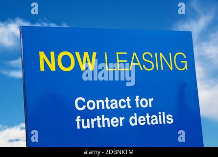 leaseing blue sign closeup over sky Stock Photo
