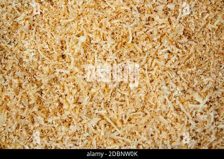 Fresh sawdust texture. Shavings background with copyspace Stock Photo