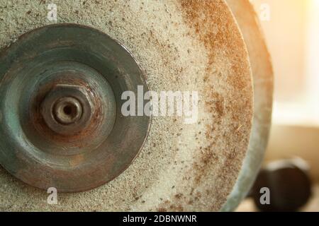 Old rusty Grindstone grinder in the workshop Stock Photo