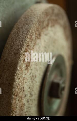 Old rusty Grindstone grinder in the workshop Stock Photo