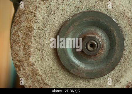 Old rusty Grindstone grinder in the workshop Stock Photo