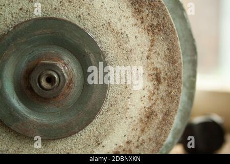 Old rusty Grindstone grinder in the workshop Stock Photo