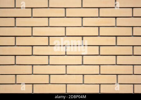 Beige bricks wall texture. New clean beige bricks background Stock Photo