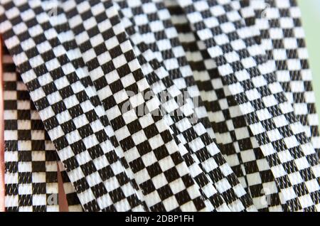 Dark and White Checkers textured plastic rope background Stock Photo