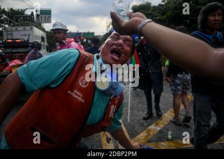 Thailand. 17th Nov, 2020. (11/17/2020) Pro-democracy protesters clean face with water after police fire tear gas during a demonstration against a charter amendment at Parliament in Bangkok. (Photo by Vichan Poti/Pacific Press/Sipa USA) Credit: Sipa USA/Alamy Live News Stock Photo
