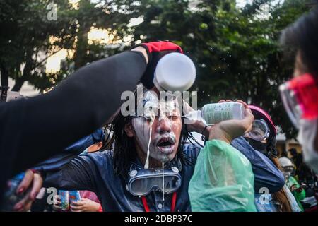 Thailand. 17th Nov, 2020. (11/17/2020) Pro-democracy protesters clean face with water after police fire tear gas during a demonstration against a charter amendment at Parliament in Bangkok. (Photo by Vichan Poti/Pacific Press/Sipa USA) Credit: Sipa USA/Alamy Live News Stock Photo