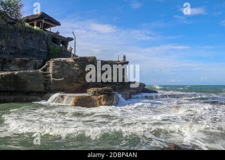 Beautiful Tanah Lot Temple in Bali Indonesia epic scene - nature and architecture background. Pilgrimage Temple of Pura Tanah Lot is perched dramatica Stock Photo