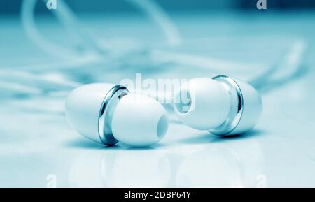 earphones buds macro closeup on table Stock Photo