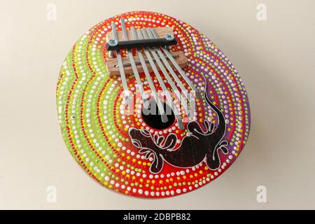 Details of a thumb piano (Kalimba, Mbira) with silver and red tines ...