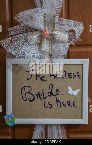 THE HOTTEST BRIDE IS HERE, an inscription written on the bride's door on the wedding day Stock Photo
