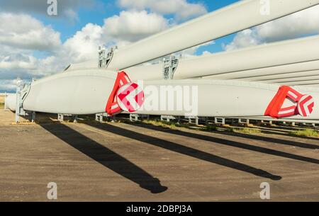 Rack of new large wind turbine blades Stock Photo - Alamy