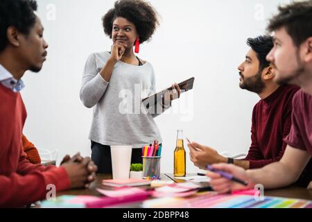 Manager woman leading a brainstorming meeting. Stock Photo