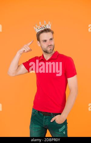 Narcissistic prince. Prince golden crown. Funky prince. Glory seeking man. Man representing power and triumph. Business king. Cheerful guy wear crown. King of style. Achieving victory and success. Stock Photo