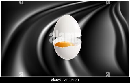 broken egg with yellow yolk on abstract black surface Stock Photo