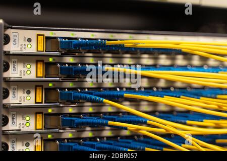 Cables connected to servers in a cables room Stock Photo