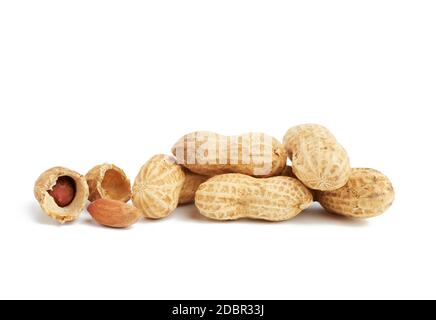 heap of peanuts in shell and broken, food isolated on white background Stock Photo