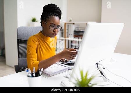 African American Business Accountant In Office Doing Accounting Work Stock Photo