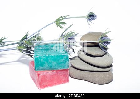 soaps off various shades with grey sone pebbles and lavender Stock Photo