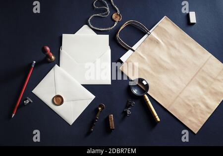 Vintage stationery set on black paper background. Responsive design mockup. Top view. Flat lay. Stock Photo