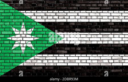 flag of Nenthead painted on brick wall Stock Photo