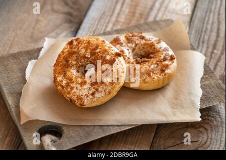 Two donuts on the wooden board Stock Photo