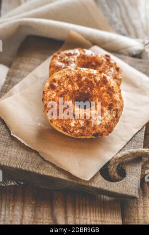Two donuts on the wooden board Stock Photo
