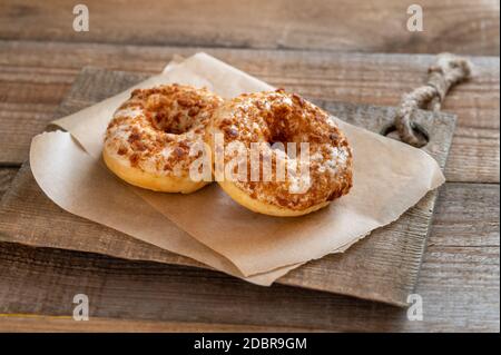 Two donuts on the wooden board Stock Photo