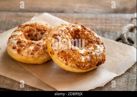 Two donuts on the wooden board Stock Photo
