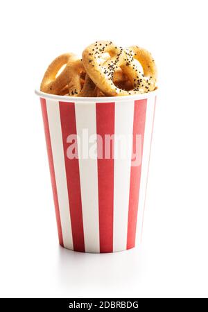 Crispy salted pretzels in paper cup isolated on white background Stock Photo