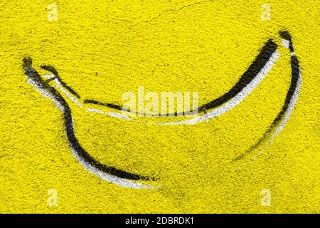 Banana graffiti on concrete wall. Backround with copy space. Stock Photo