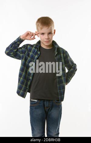 boy put his index finger to the temple on a white background Stock Photo