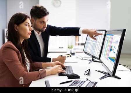 Financial Advisor And Business Analyst Working On Computer Stock Photo