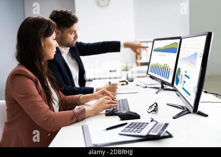 Financial Advisor And Business Analyst Working On Computer Stock Photo