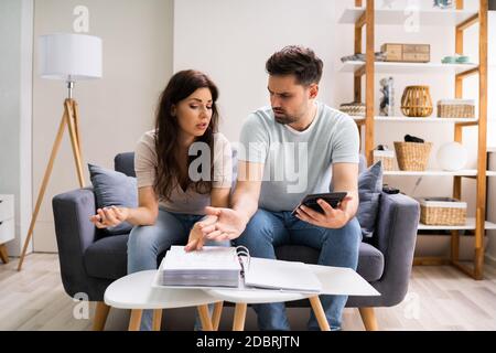 Family In Financial Trouble Having Stress Over Debt And Money Stock Photo