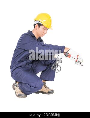 Young handyman in uniform hold grinder, Cutout isolated on white background Stock Photo