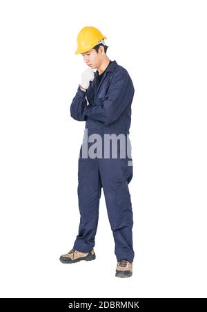 Portrait of a workman with blue coveralls and hardhat in a uniform on white background with clipping path Stock Photo