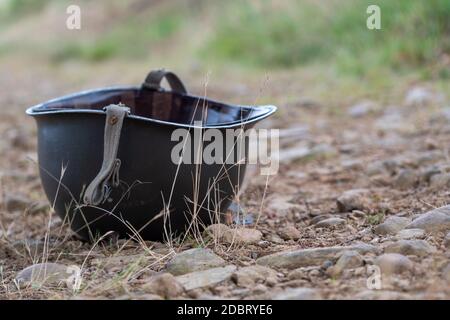 a US M1 helmet on the ground Stock Photo