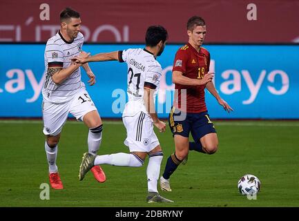 Seville, Spain. 17th Nov, 2020. Dani Olmo (R) of Spain vies with Ilk Gundogan (C) and Niklas Sule (L) of Germany during the UEFA Nations League group match between Spain and Germany in Estadio La Cartuja in Seville, Spain, Nov. 17, 2020. Credit: Pablo Morano/Xinhua/Alamy Live News Stock Photo