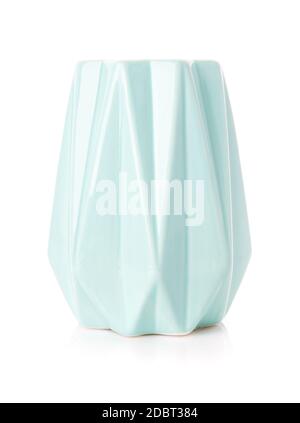 Decorative ribbed vase of turquoise color on a white background. Modern home decor. Stock Photo