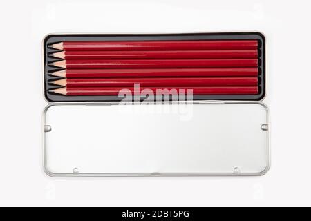 Pencils in a silver metal box isolated on white background Stock Photo
