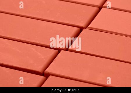 A stack of bricks for construction, hollow brick. Material for construction and repair. Clay brick, brick texture, preparation for the construction pr Stock Photo